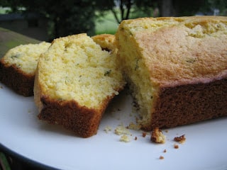 lemon thyme cornbread loaf with two slices on a plate