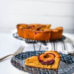 plum cake on blue plate with fork