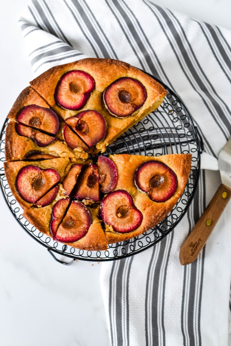 spiced plum cake with piece gone