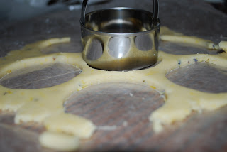 cutting lemon lavender cookie dough with circle cookie cutter