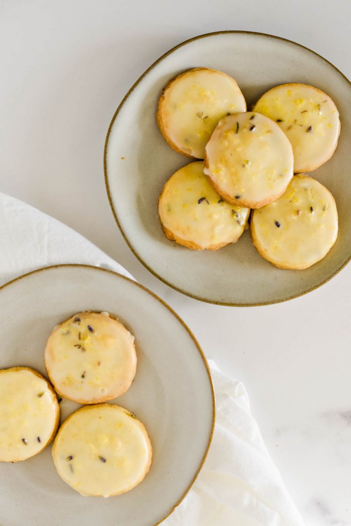 overhead of two plates of lemon lavender cookies