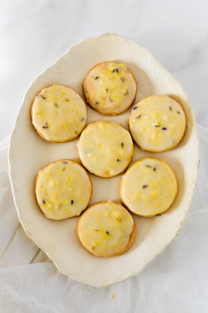 overhead view of lemon lavender cookies on white platter