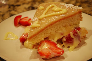 slice of fresh fraisier cake on place with strawberries