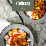 two plates of sweet and sour kielbasa with text overlay of recipe name