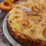 closeup view of German peach kuchen cake on serving platter