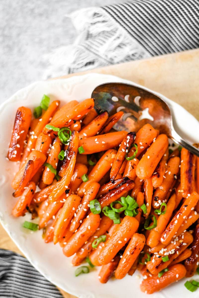 white dish with roasted carrots