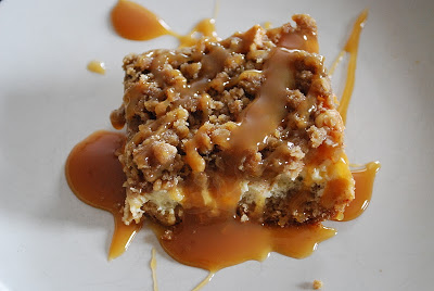 cheesecake bars topped with cinnamon apples, streusel and caramel sauce