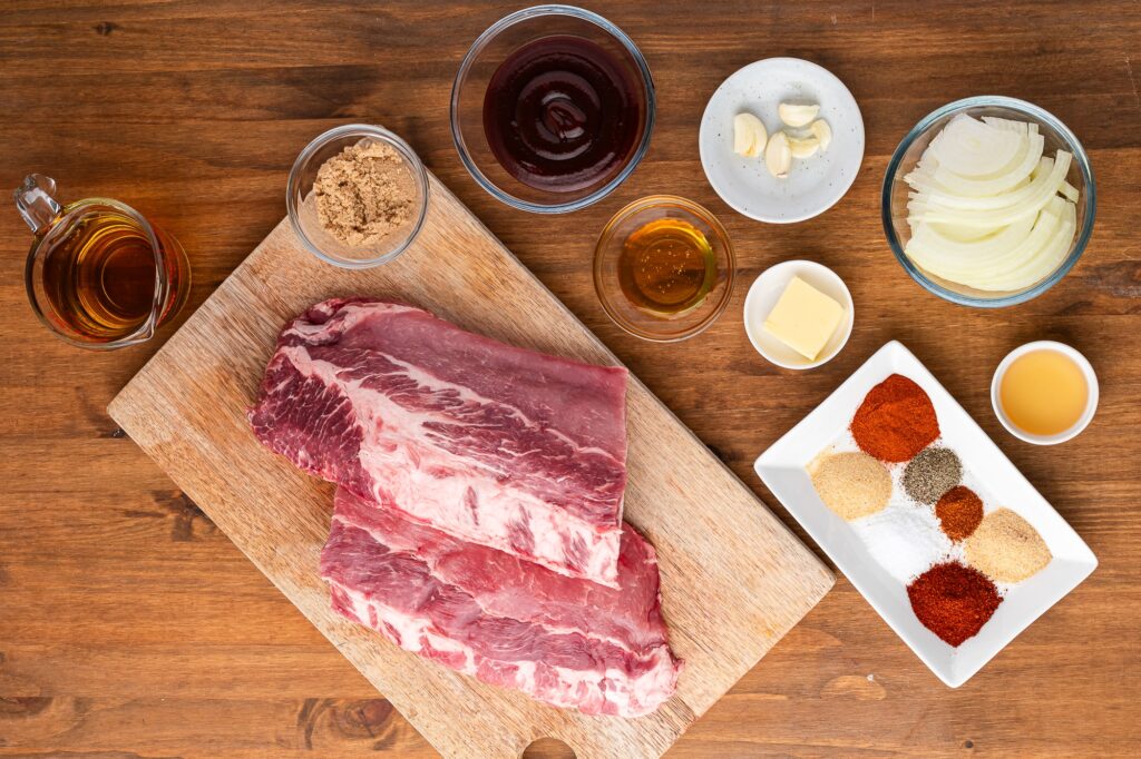 ingredients for slow cooker baby back ribs on wooden counter