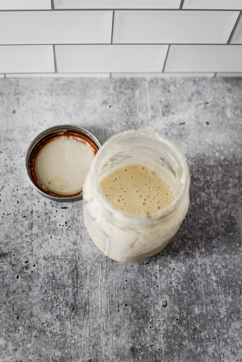 overhead view of mason jar with sourdough starter inside