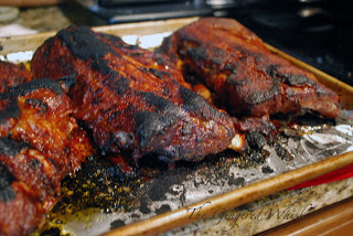 slow cooker ribs on baking sheet being broiled