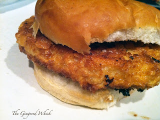 breaded pork tenderloin sandwich on bun 