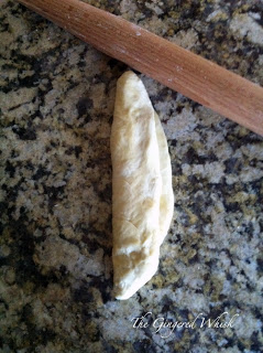 showing how to shape challah