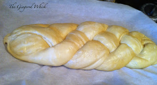 freshly braided challah bread ready to be baked