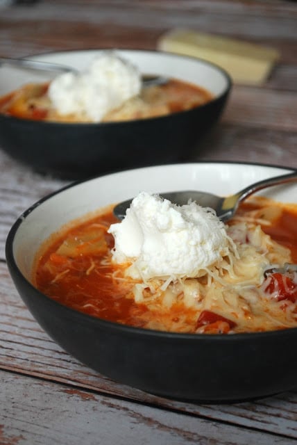 Healthy and comforting stovetop chicken lasagna stew in a bowl with ricotta!