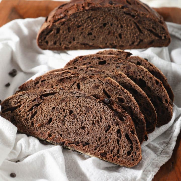 sourdough chocolate bread loaf with slices in front