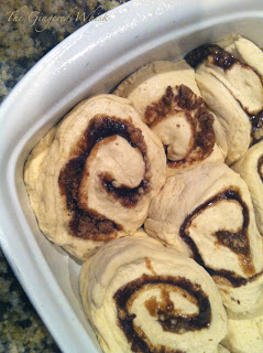 white baking dish with cinnamon rolls ready to be baked