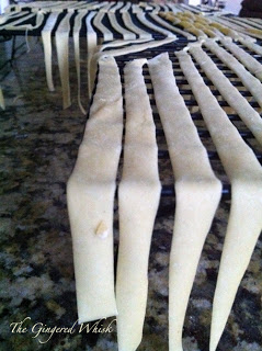 homemade sourdough pasta drying on racks
