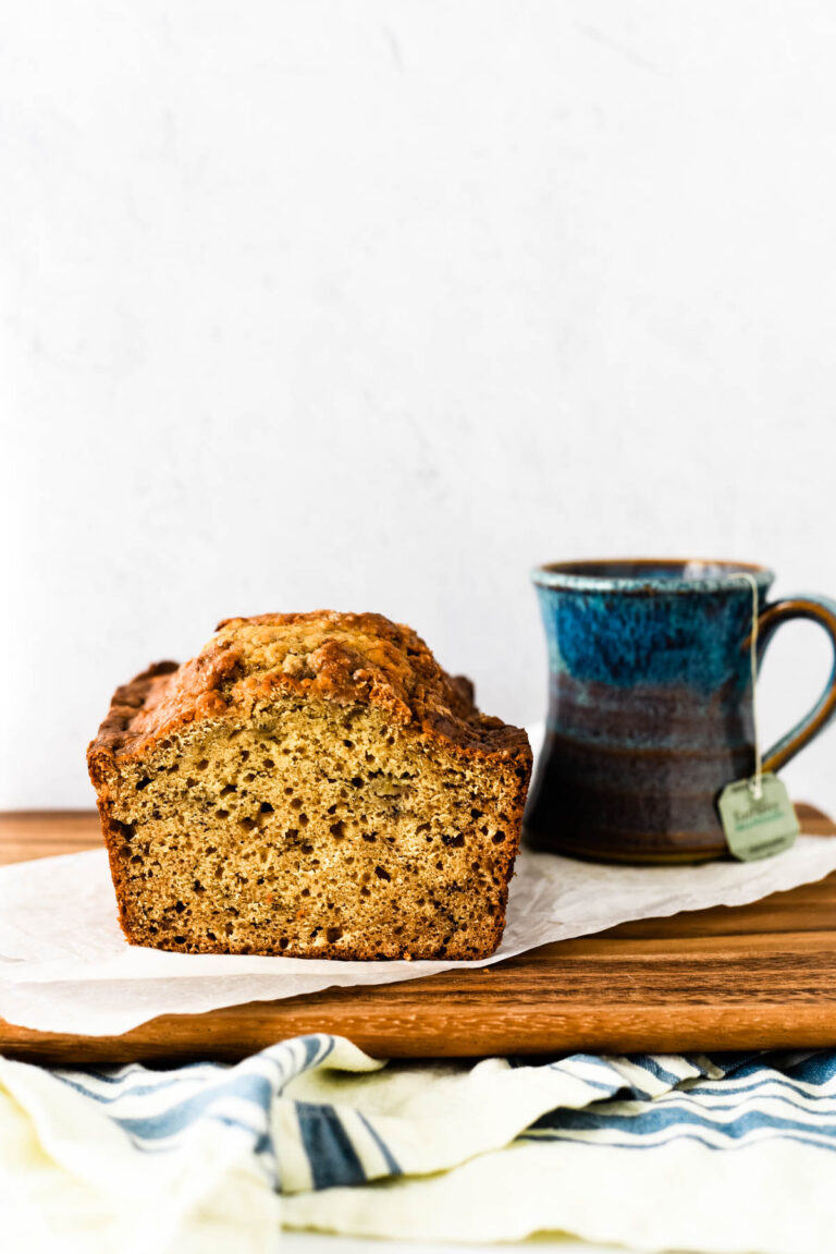 earl grey tea cake loaf with mug of tea beside