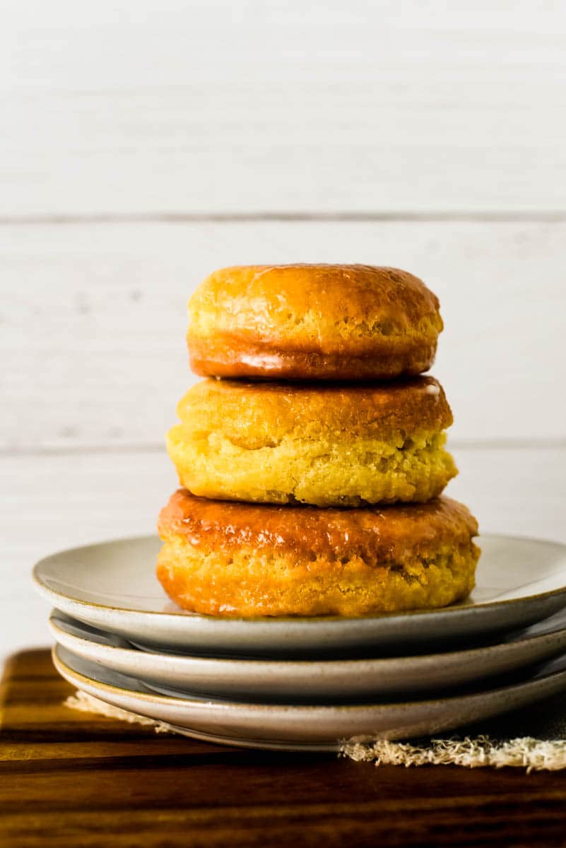 stack of three sourdough donuts on stack of small plates