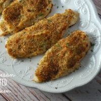 parmesan crusted chicken on white platter