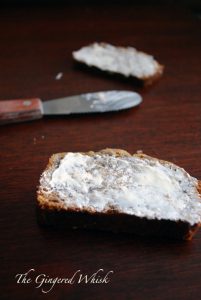 slice of earl grey bread with butter knife