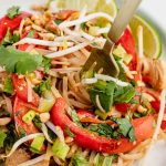 fork in bowl of chicken pad thai