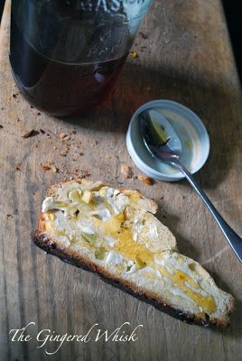 slice of apple challah with butter and honey 