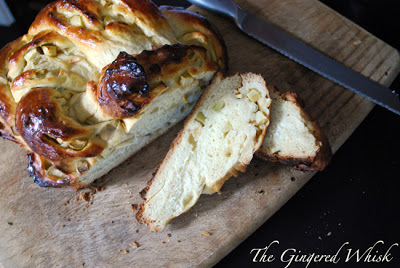 Honey and Apple Challah loaf with slice and knife beside