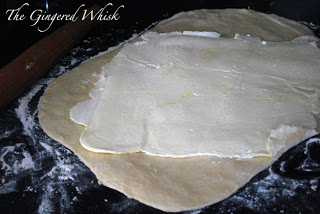 adding butter to sourdough pastry dough