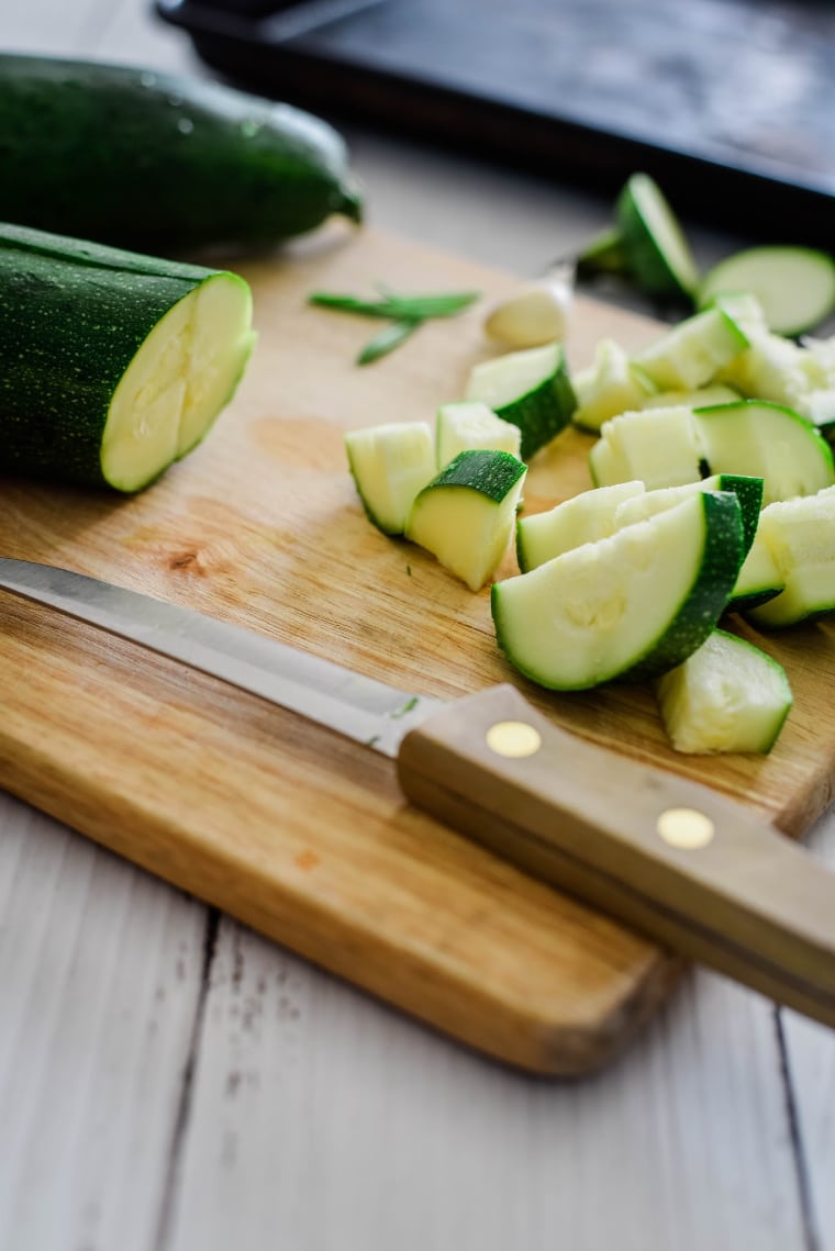 zucchini being cut to roast