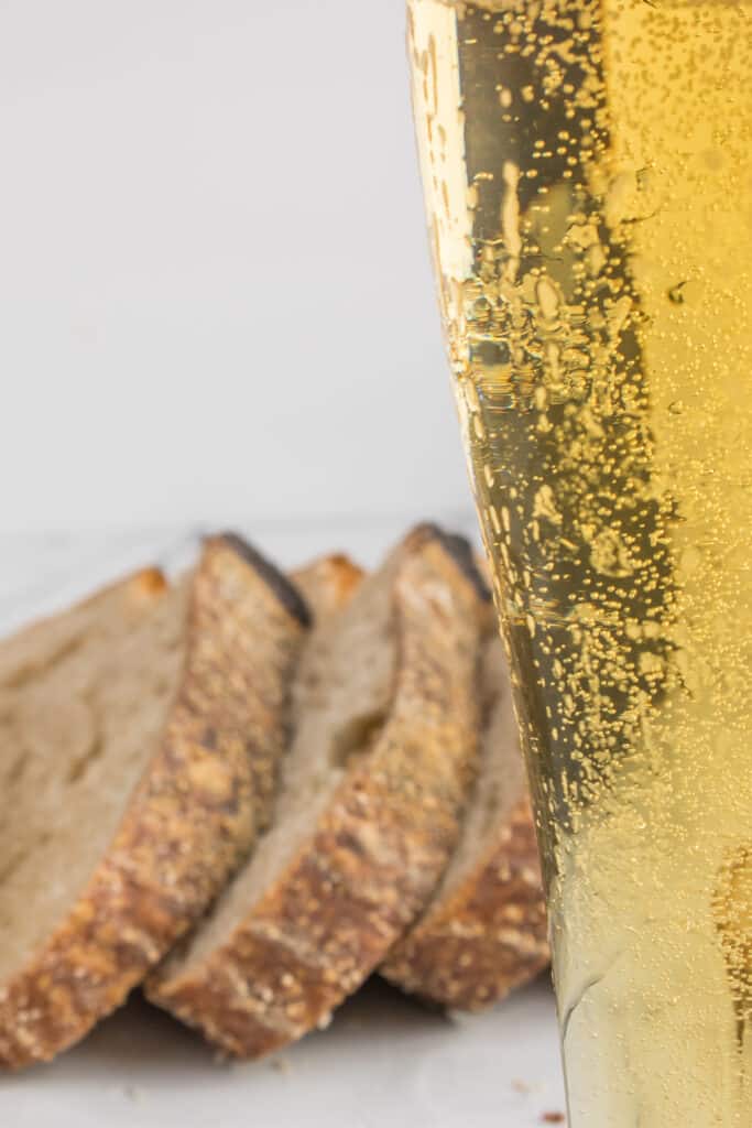 slices of sourdough bread next to beer glass