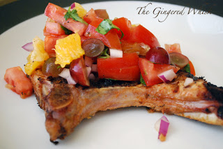 grilled pork chop with fruit salsa on top