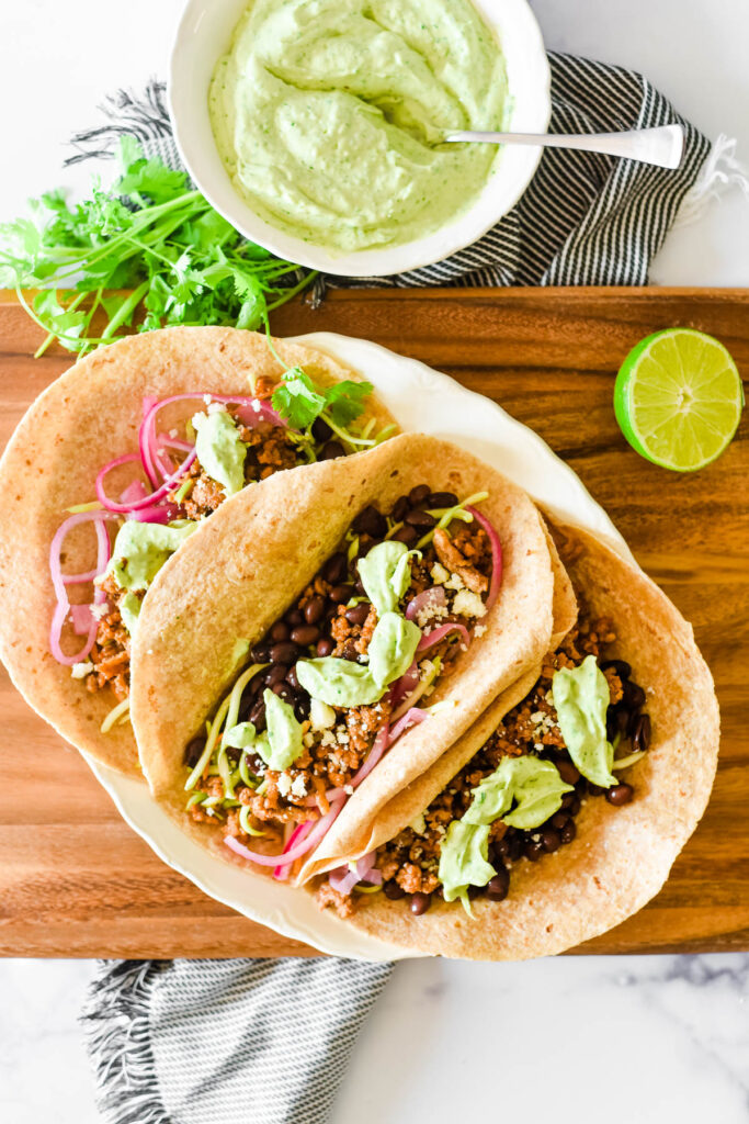 tacos with ground pork and avocado sauce