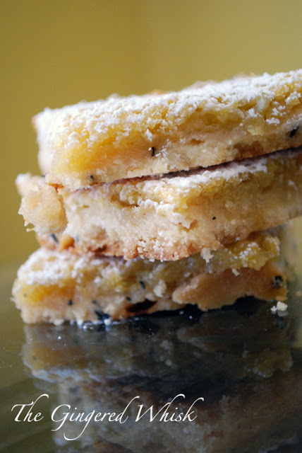 close up of three slices of lemon bars with earl grey tea