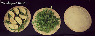 tortilla on counter with arugula on top