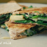 quesadilla cut into quarters, filled with arugula and apples
