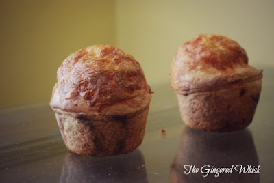 two sourdough popovers on counter