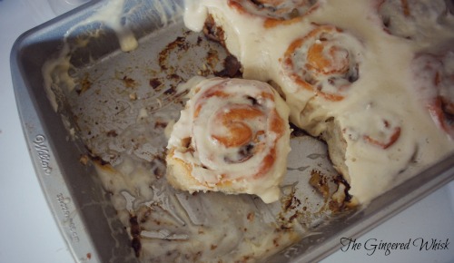baking pan with cinnamon rolls with brown butter frosting 