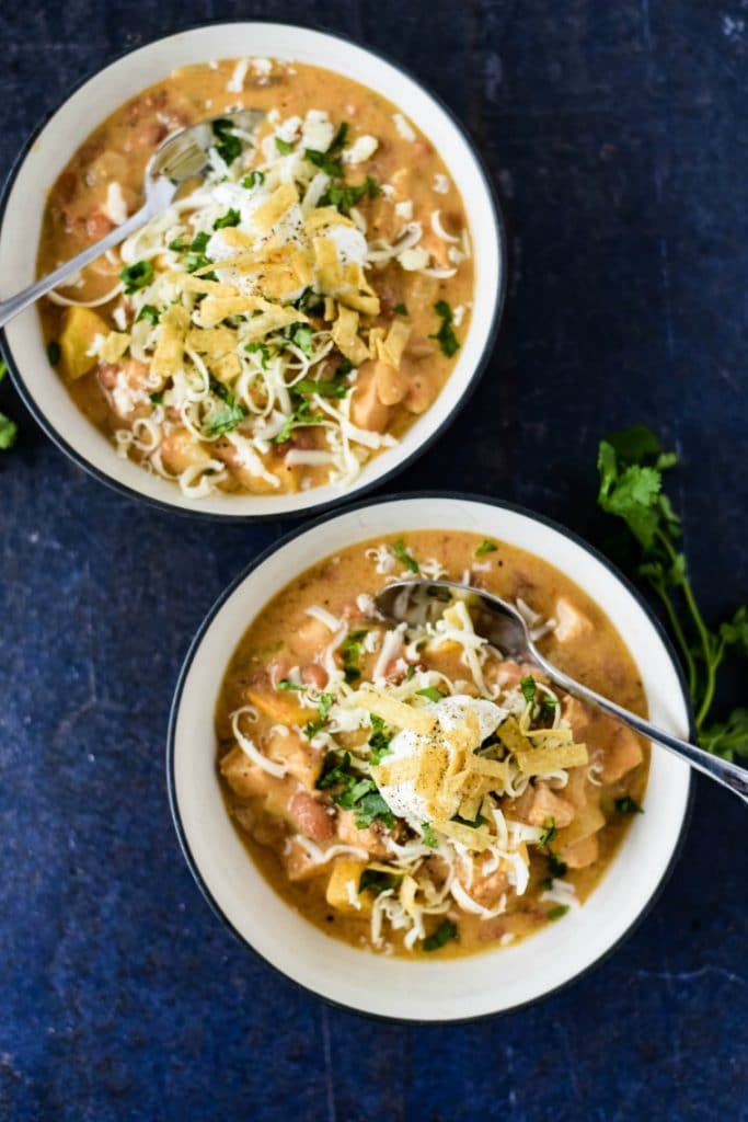 Top down view of two bowls of apple chicken chili
