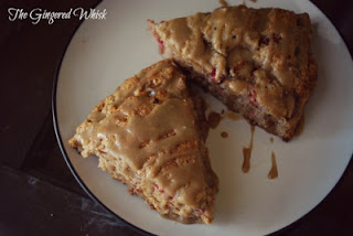 two sourdough scones on plate with brown butter glaze