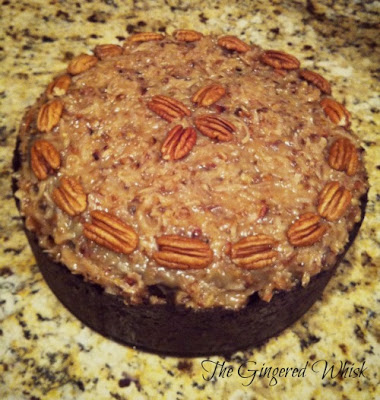 top down view of german chocolate cheesecake with pecans on border