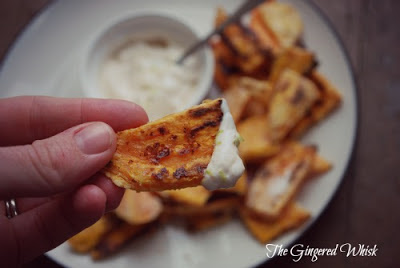 Perfectly crispy homemade sweet potato fries held with dip