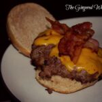 venison burger with bacon and cheese on bun