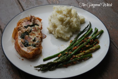 plate with mashed potatoes, roasted asparagus and chicken ballotine slice