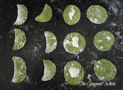 filling and forming ravioli with homemade sourdough spinach pasta dough 