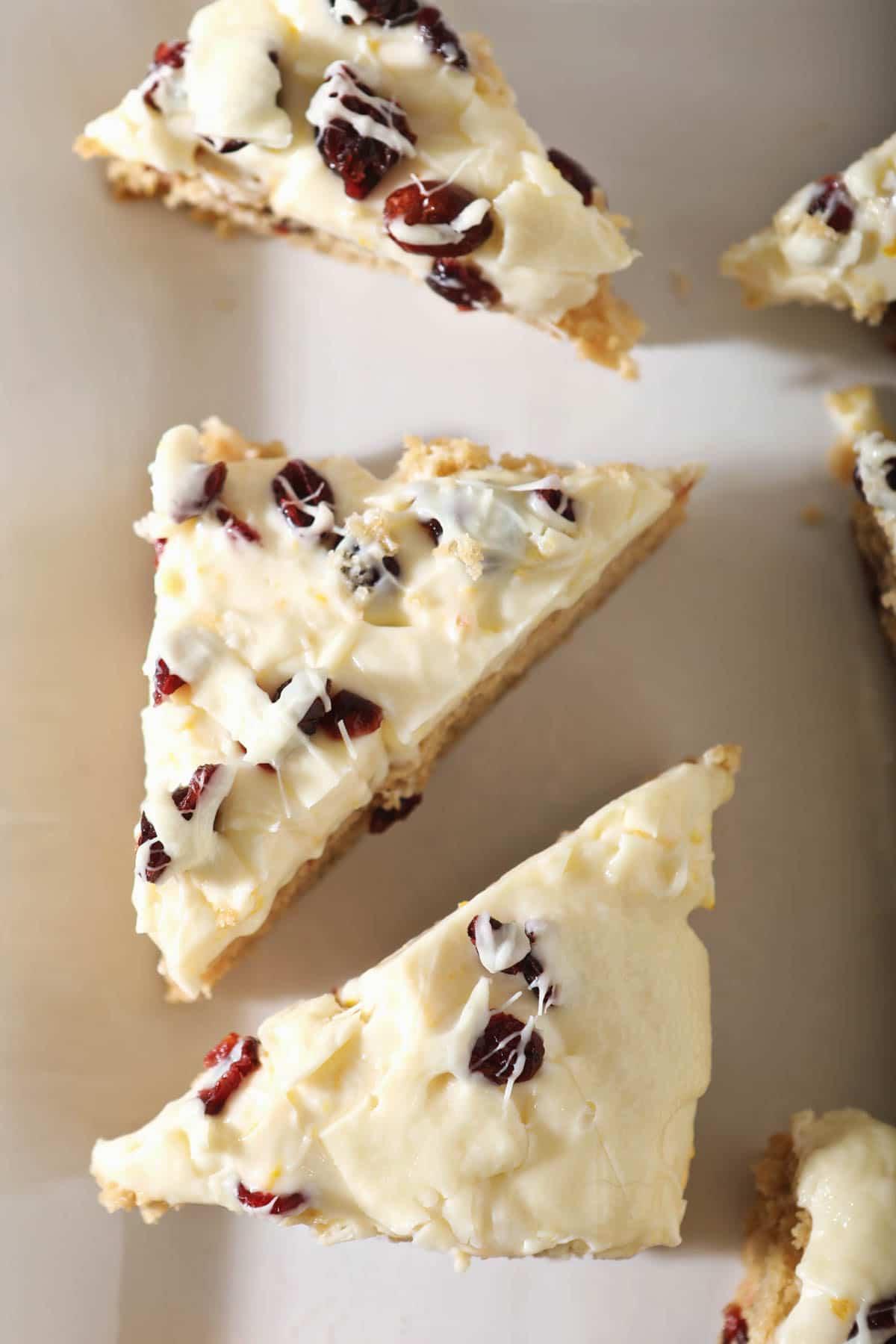 close up view of cut sourdough blondies with white chocolate drizzle