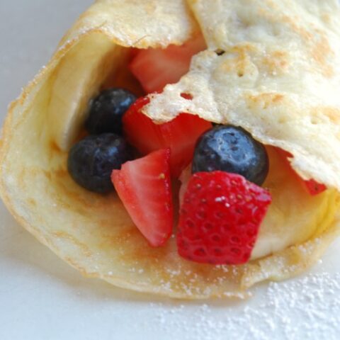 close up of sourdough crepe filled with berries