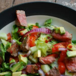 steak dinner salad on plate