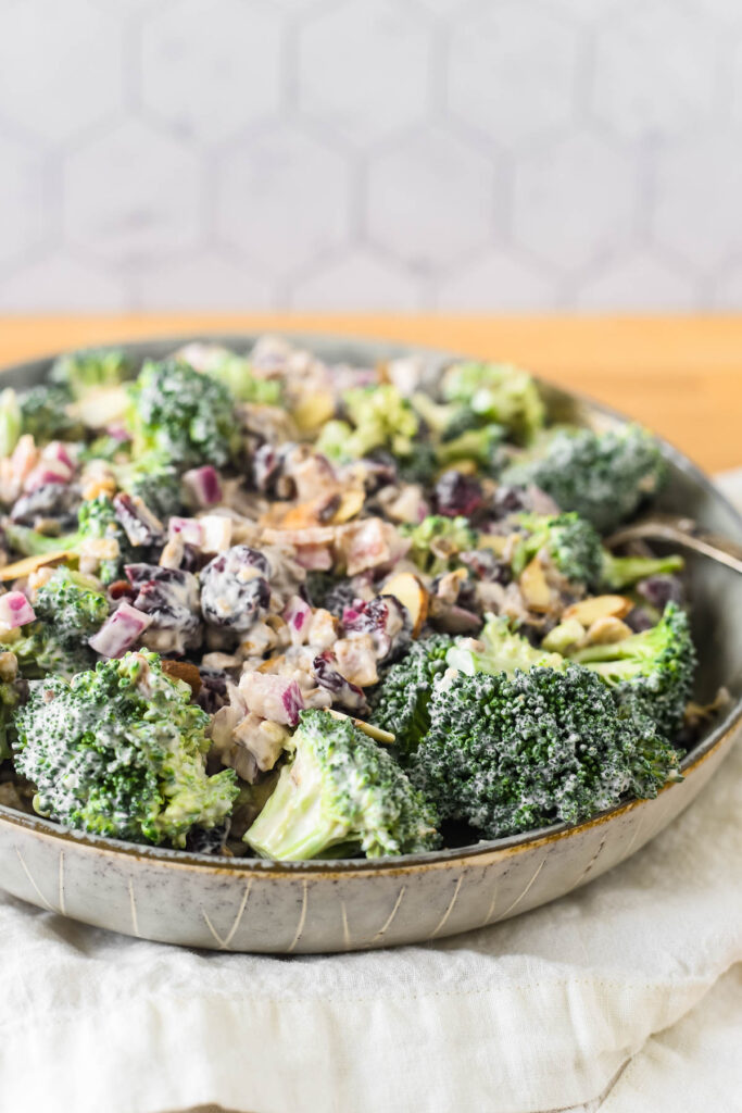broccoli salad with cranberries and bacon in bowl