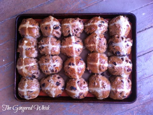 baking tray with twenty freshly baked sourdough hot cross buns